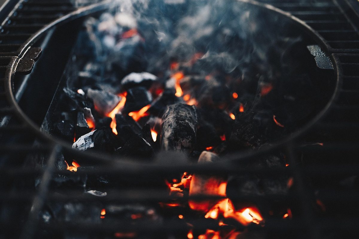 Quality BBQ smoking operation with tender meats and professional outdoor grilling technique